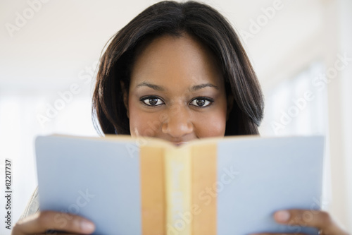African American woman reading book
