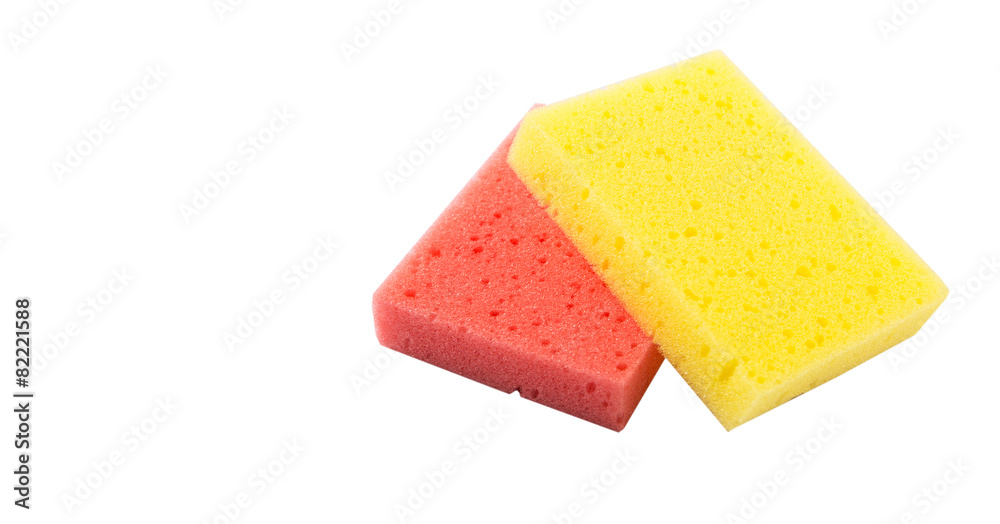 Red and yellow dish washing sponge over white background