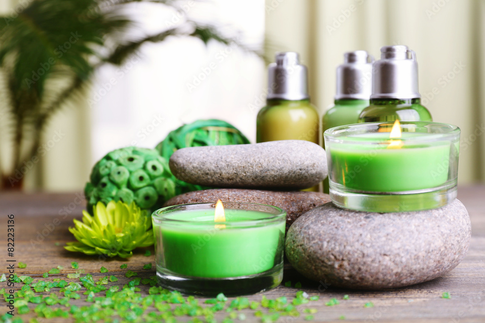 Beautiful spa composition with spa stones and candles on fabric background Beautiful spa composition with spa stones and candles on fabric background