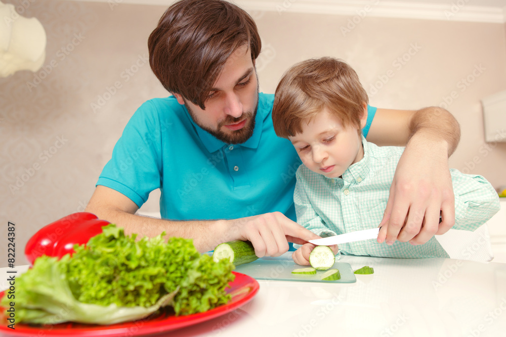 Father cooks with his son Father cooks with his son