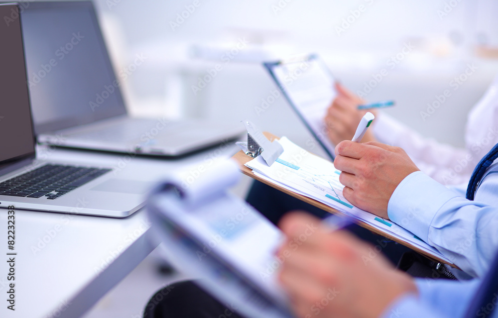 Fototapeta premium Business people sitting and writting at business meeting, in
