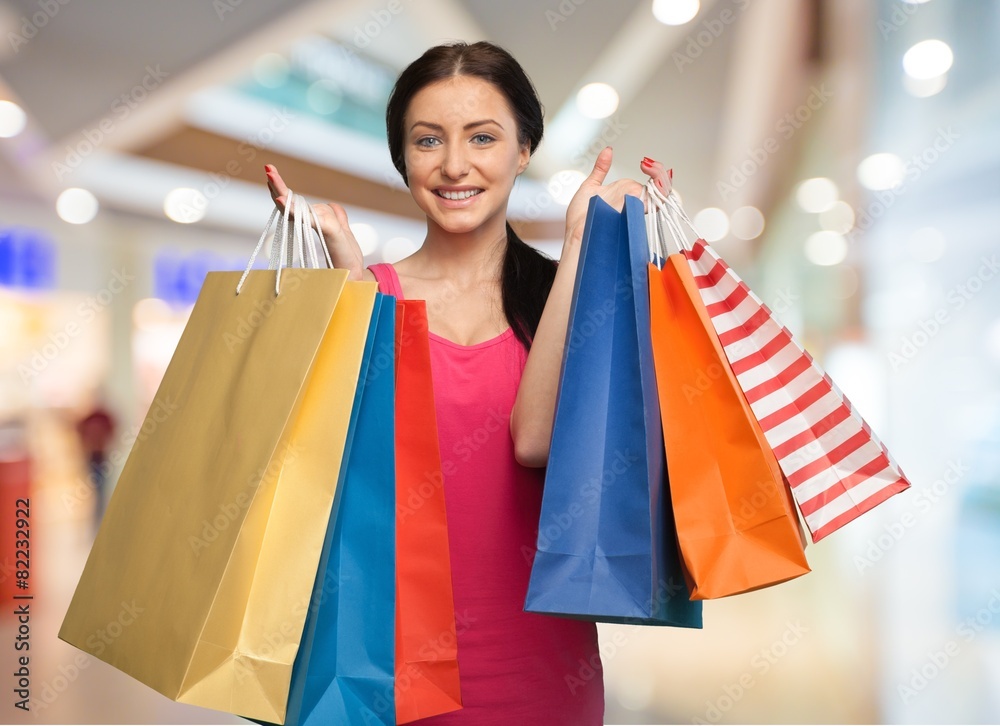 Shopping. Beautiful Brunette with Shopping Bags. Isolated. Shopping. Beautiful Brunette with Shopping Bags. Isolated.