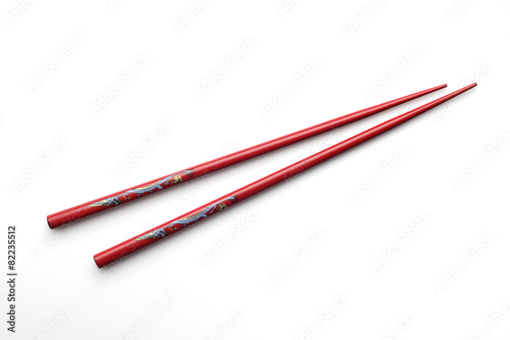 Red wooden chopsticks on white background Red wooden chopsticks on white background