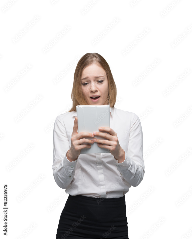 Young business lady is looking at the tablet. Young business lady is looking at the tablet.