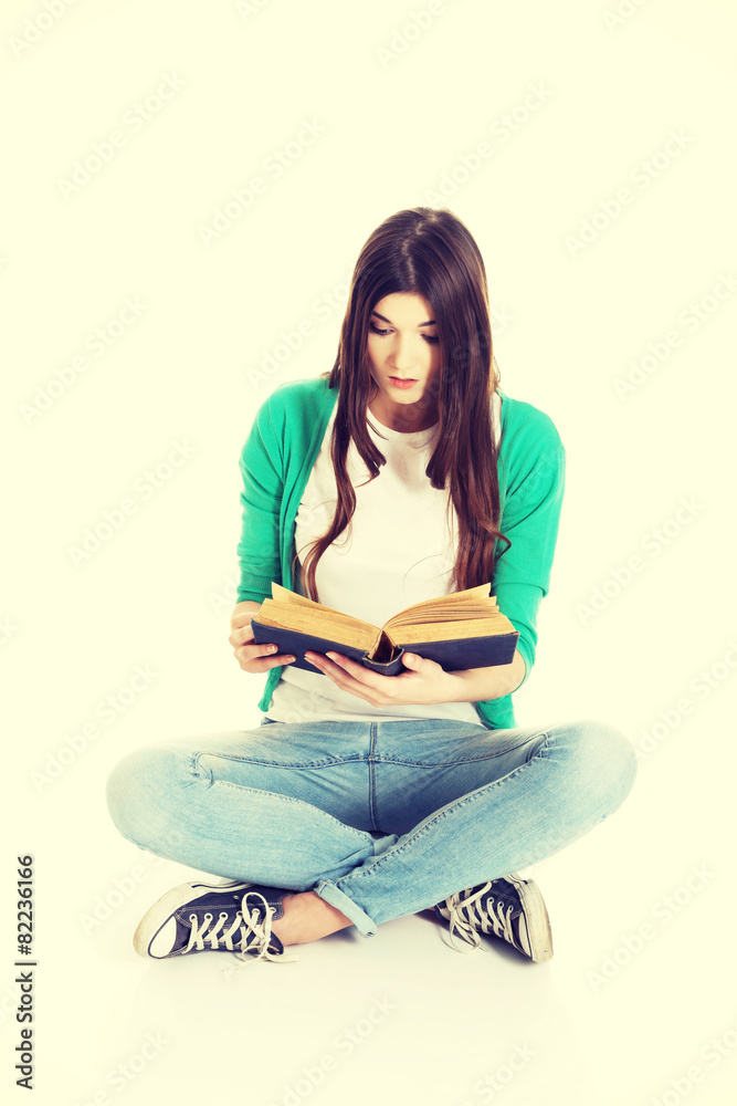 Teenager reading book
