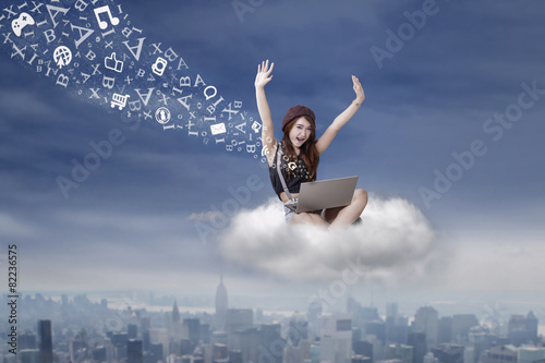 Successful girl sending message from the cloud