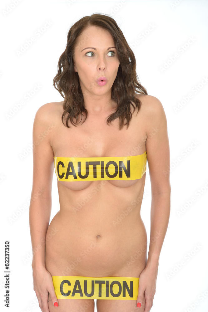Naklejka premium Sexy Sensual Naked Young Pin Up Woman Wearing Yellow Caution Tap