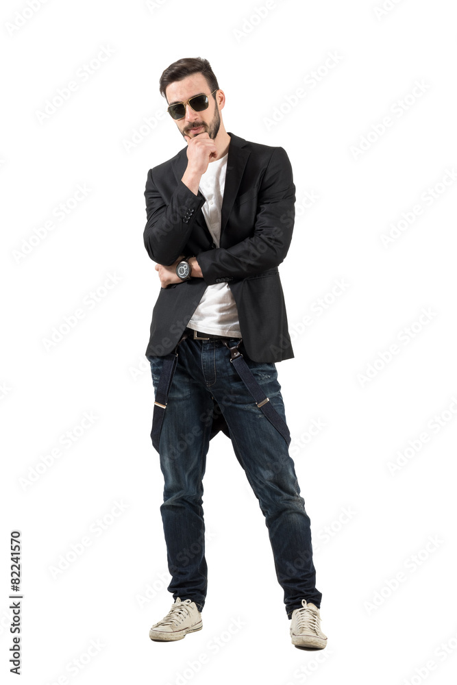 Young bearded guy with sunglasses thinking Young bearded guy with sunglasses thinking