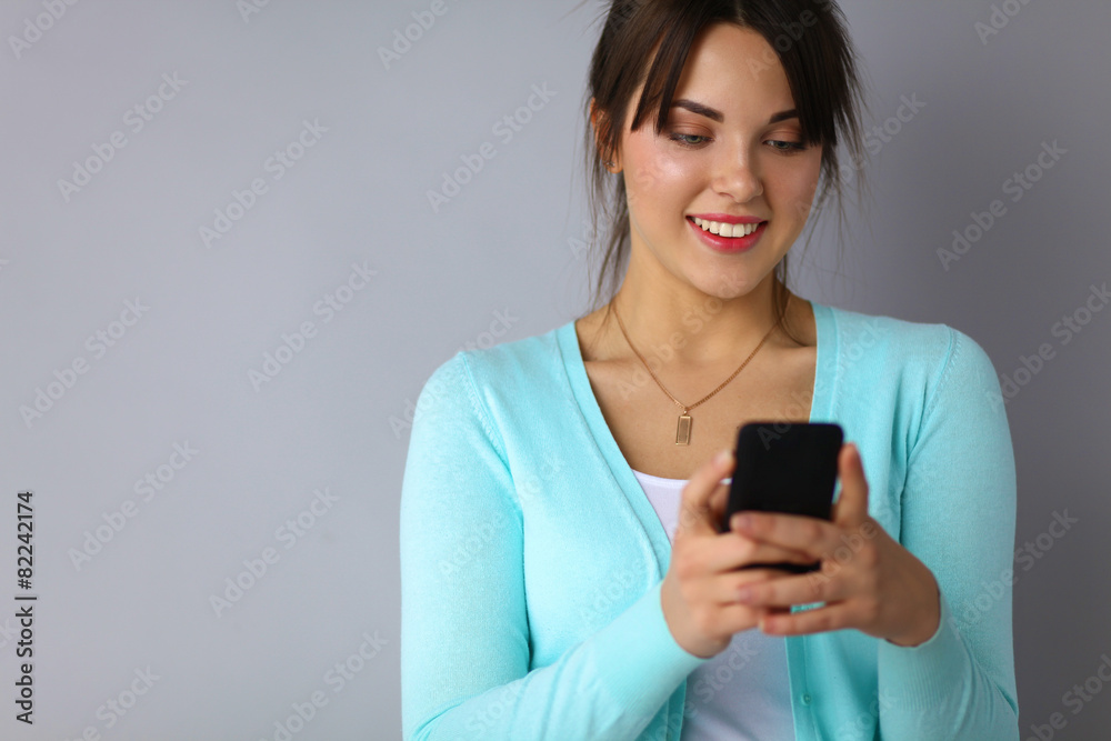 Woman using and reading a smart phone Woman using and reading a smart phone