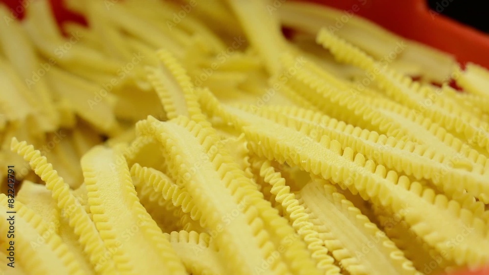 dried pasta in container - closeup - worker controls quality dried pasta in container - closeup - worker controls quality