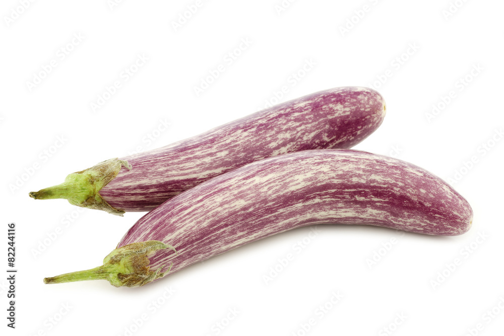 two striped aubergines on a white background two striped aubergines on a white background