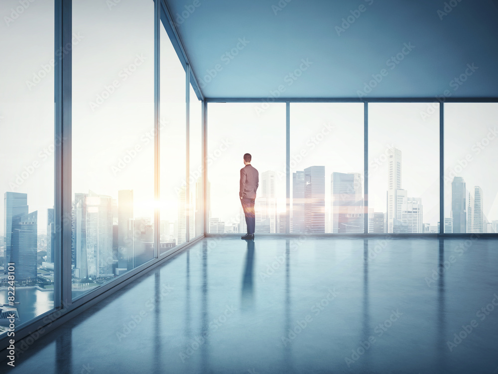 Fototapeta premium Businessman looking at sunrise. 3d render