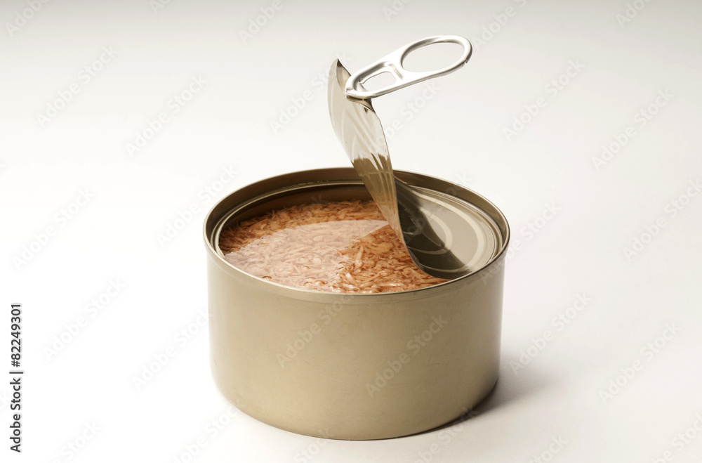 open tuna tin on a white background open tuna tin on a white background
