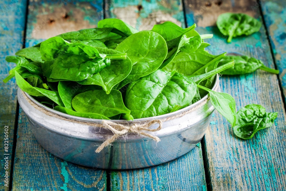 raw fresh organic spinach in a bowl raw fresh organic spinach in a bowl