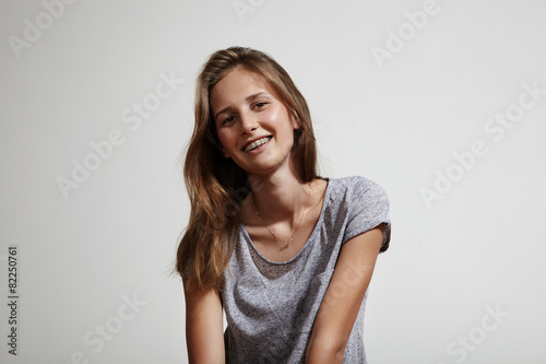 shiny smiling girl with tooth brackets