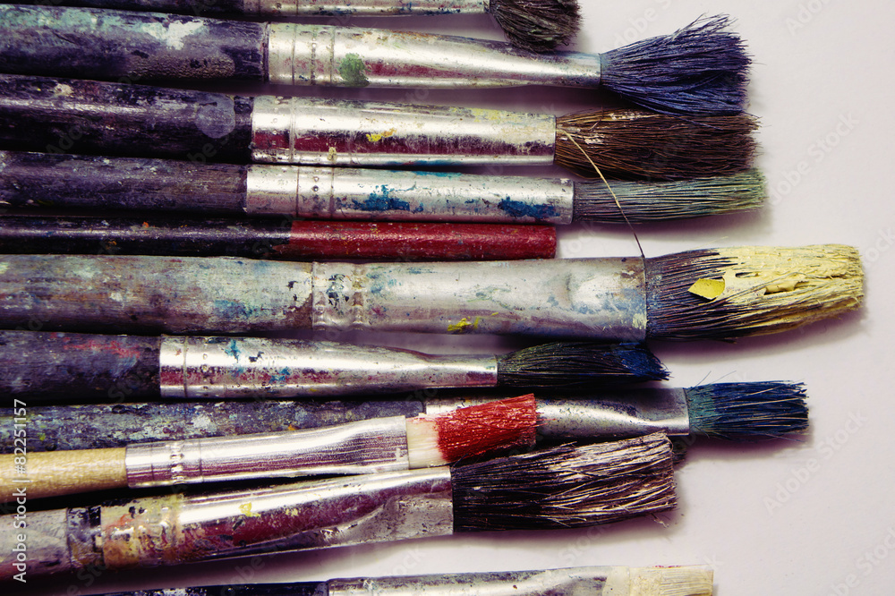 Fototapeta premium Used paint brushes on a white background.