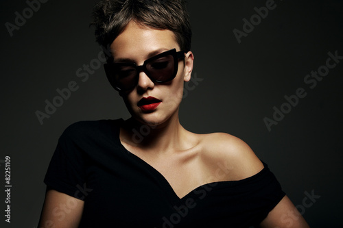 dark portrait of woman wearing sunglasses