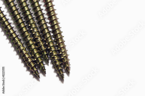 Row of metal screws, isolated on white