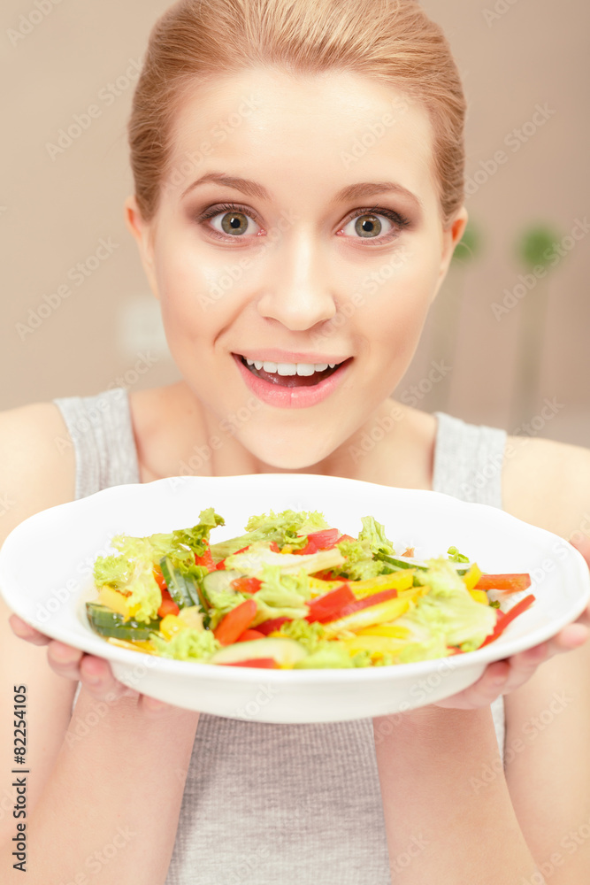 Young woman cooks salad Young woman cooks salad