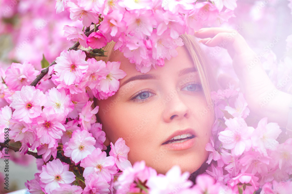 spring outdoor portrait of a charming girl in flowers bloom spring outdoor portrait of a charming girl in flowers bloom