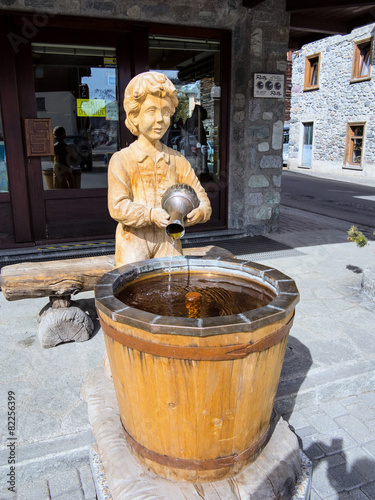 interesting fountain of water in the Italian mountains photo