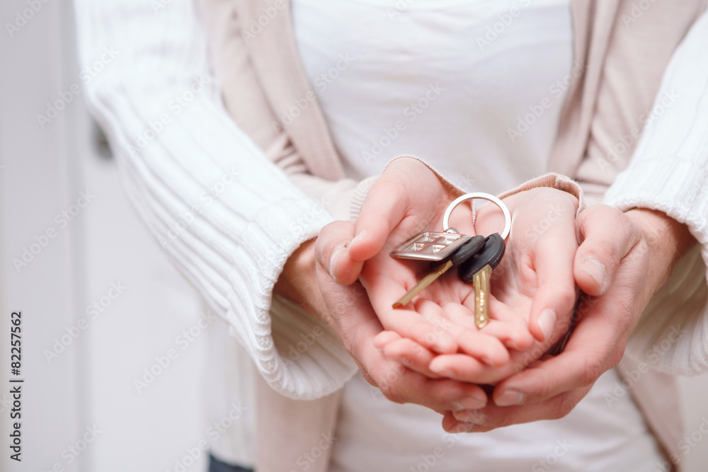 Two people holding keys