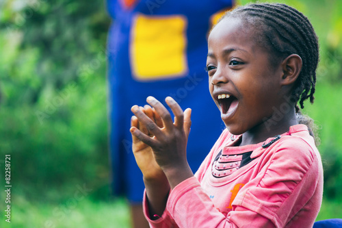 Ethiopian girl singing and clapping in kindergarten
