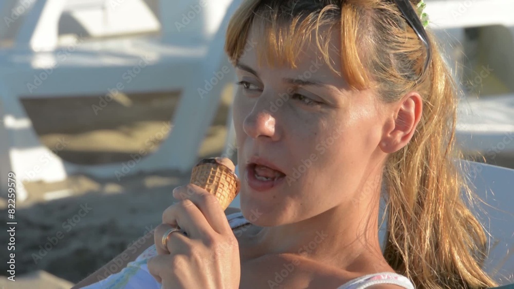 beautiful young woman who enjoy an ice cream beautiful young woman who enjoy an ice cream