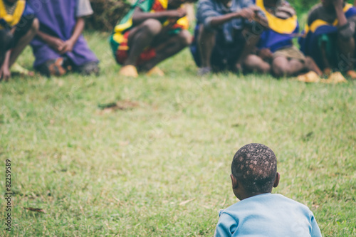 Ethiopian boy sitting on the grass in the nursery