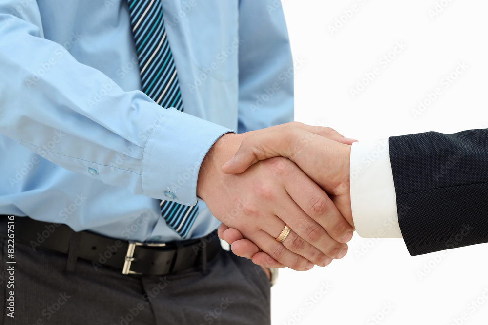 Close-up image of a firm handshake  between two colleagues on a