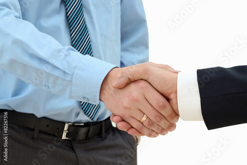 Close-up image of a firm handshake between two colleagues on a