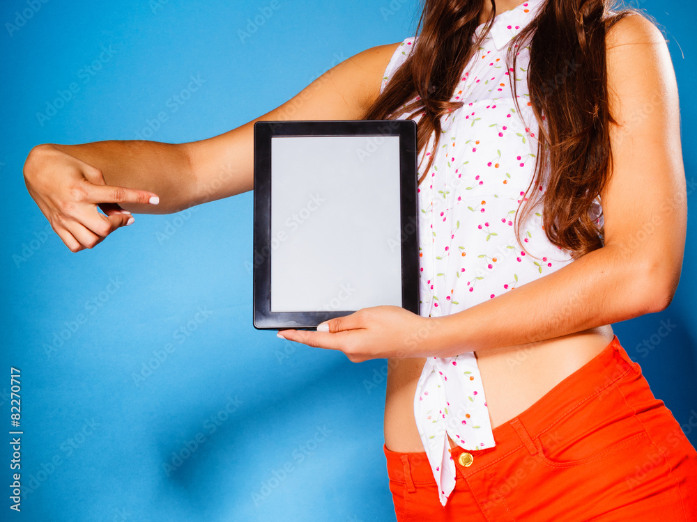 Girl showing blank copy space screen of tablet touchpad
