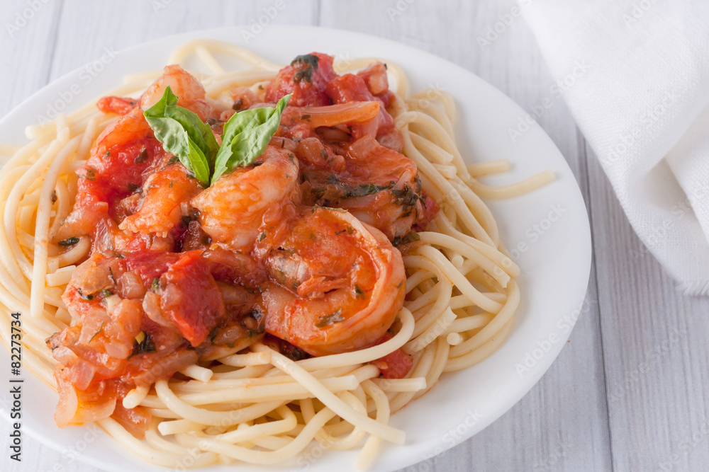 shrimp in wine tomato sauce over spaghetti pasta