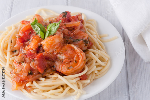 shrimp in wine tomato sauce over spaghetti pasta