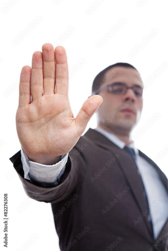 Confident young businessman asking you to stop Confident young businessman asking you to stop