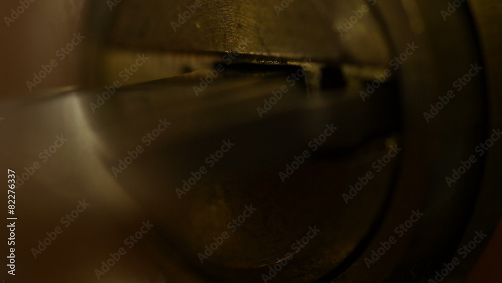 Key sliding into lock and locking\ unlocking door. 4K UHD. 