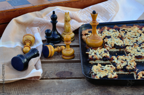 Plum pie and chess on the garden bench