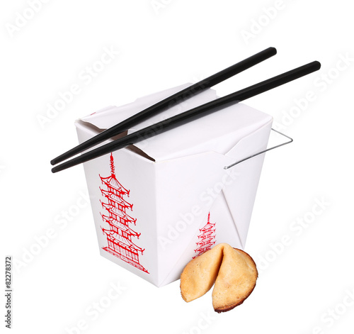 chinese food box container with fortune cookie and chopsticks is
