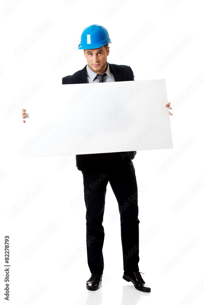 Businessman enginner holding empty banner.