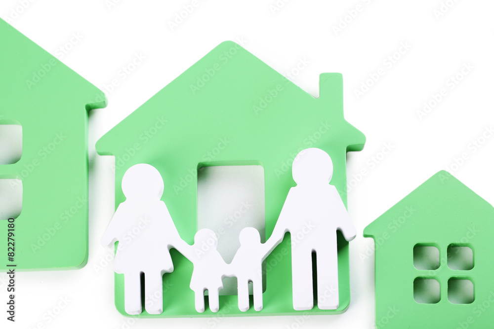 Toy houses with family isolated on white Toy houses with family isolated on white