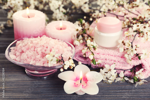 Spa still life with flowering branches on wooden table, closeup