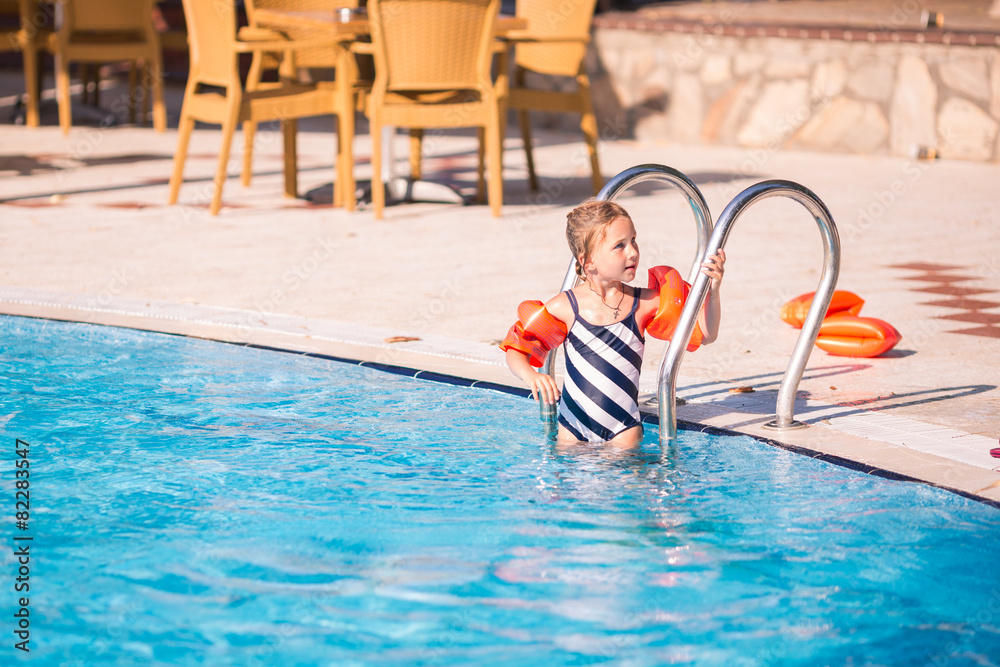 Cute little girl in swimming pool