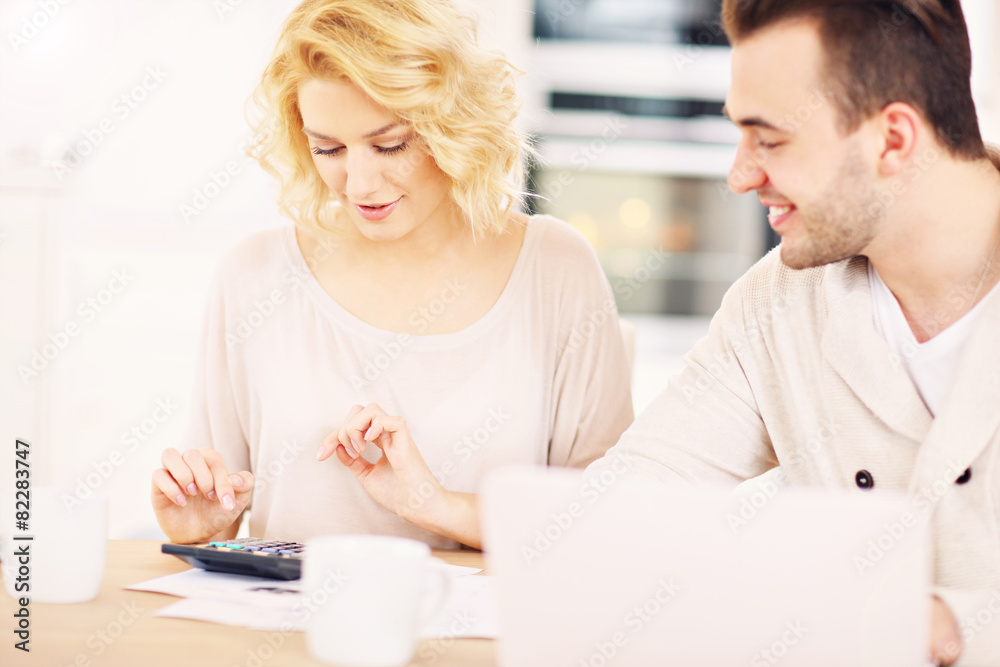 Couple working on home budget Couple working on home budget