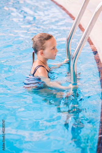 Cute little girl in swimming pool