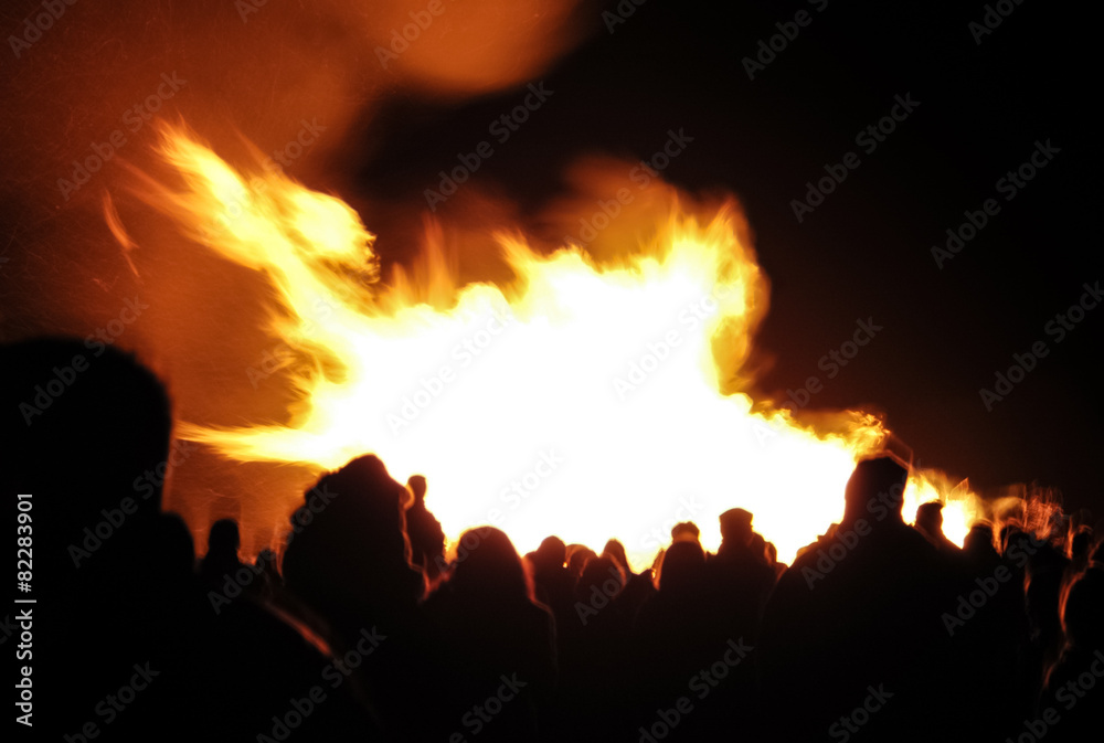 motion blur of a crowd around a bonfire
