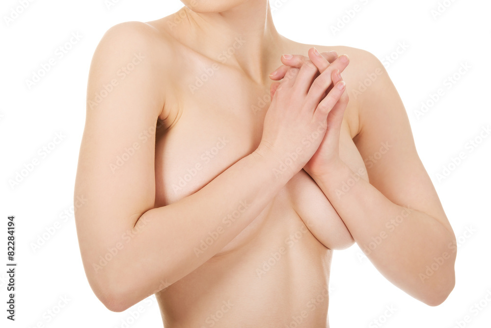 Fototapeta premium Topless woman covers her breast.