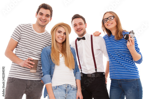 Four stylish young people on white background