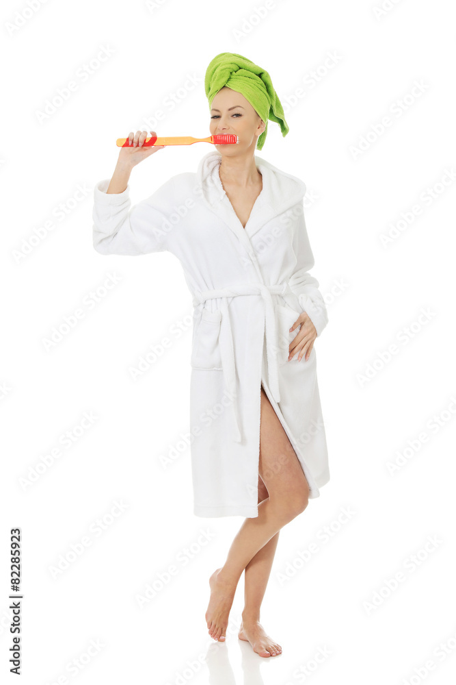 Beautiful woman with oversized toothbrush. Beautiful woman with oversized toothbrush.