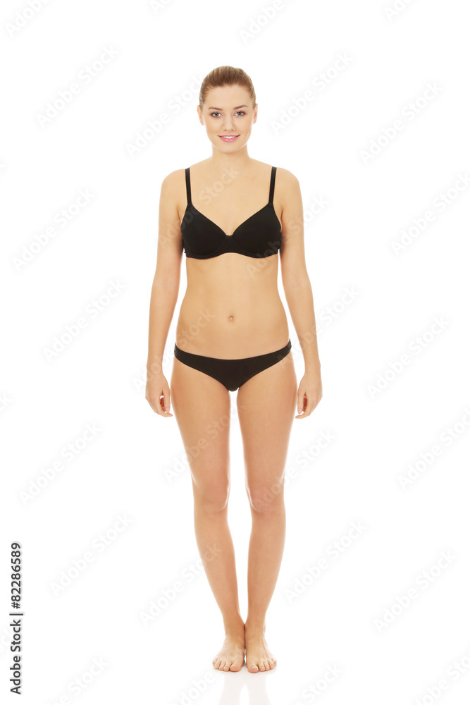Fototapeta premium Happy woman standing in bikini.