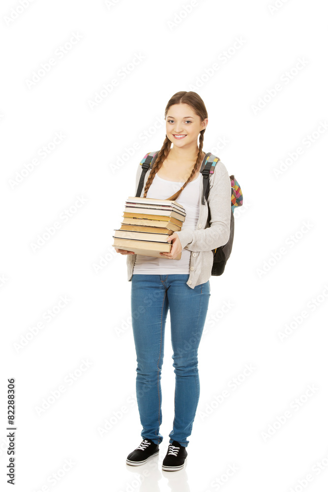 Beautiful teenager with backpack and books. Beautiful teenager with backpack and books.